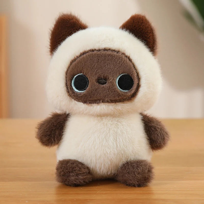 Plush toy resembling a kawaii panda on a wooden surface with a blurred background