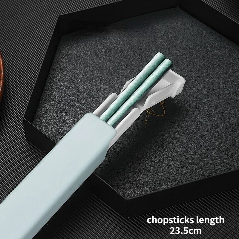 Light blue kawaii chopsticks with white holder on a dark textured surface