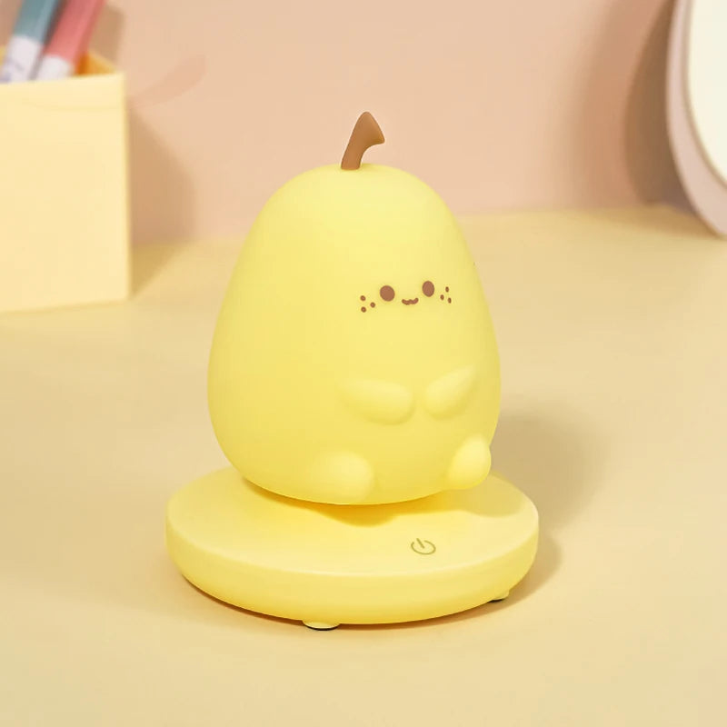 Yellow kawaii pear-shaped night light with a smiling face on a beige background