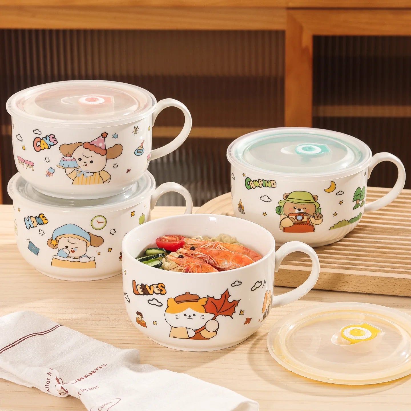 Four cartoon themed kawaii ramen bowls on a table