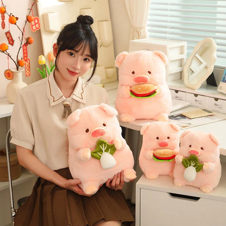 Woman holding a kawaii plush pig toy with more plush pigs on a desk.