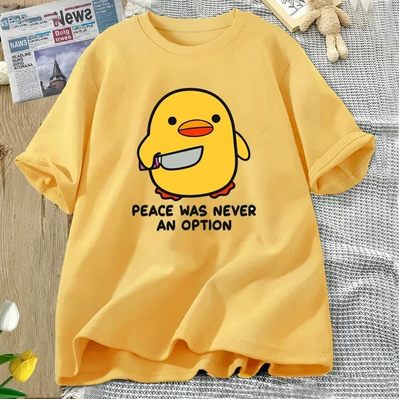 Yellow t-shirt with a kawaii cartoon duck and text on a textured surface