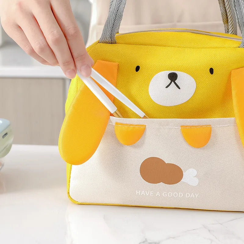 Yellow bear-shaped kawaii bag with a face design and text 'Have a good day' on a neutral background.