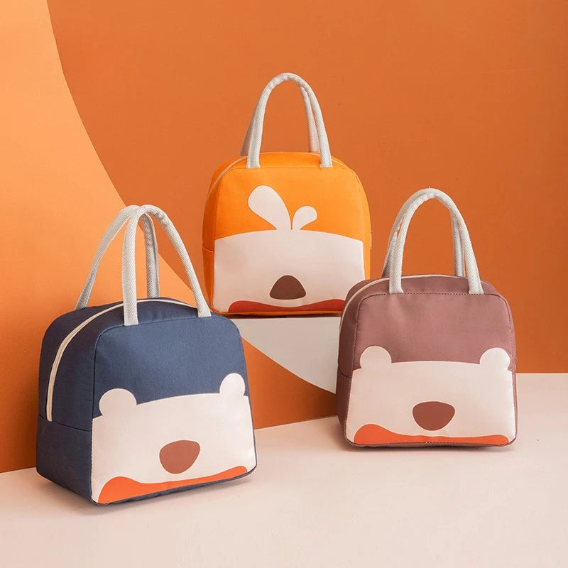Three bear-shaped kawaii bags in different colors on a peach background