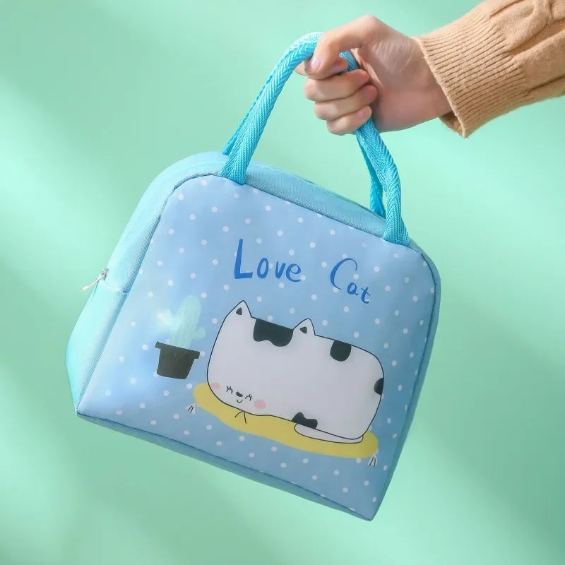 Blue kawaii bag with a cartoon cat design and 'Love Cat' text on a light green background