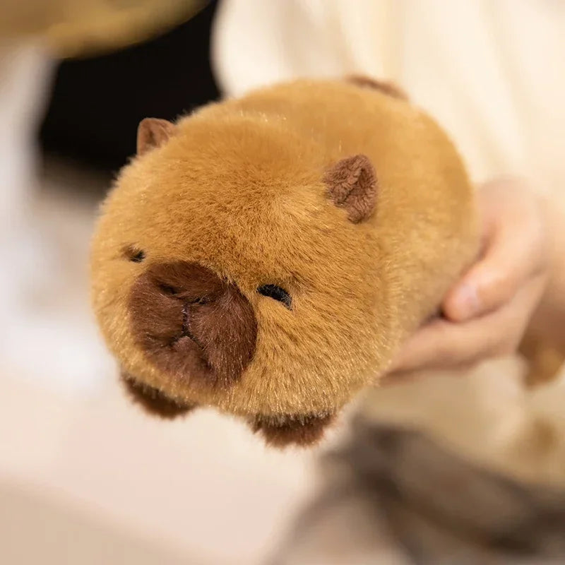 Close-up of a brown kawaii plush toy resembling a bear with a blurred background