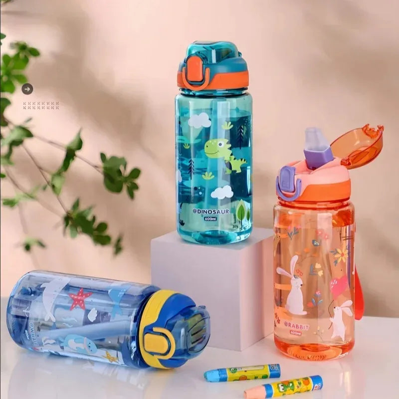 Three colorful kawaii water bottles with different designs on a light background
