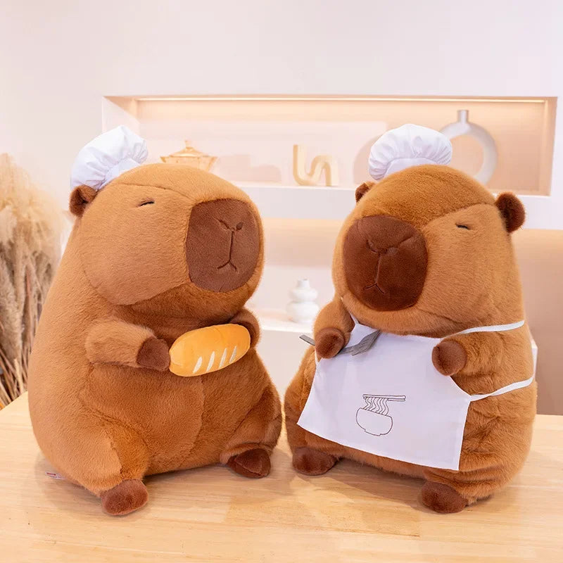 Two kawaii plush toys resembling groundhogs in a kitchen setting with a blurred background.