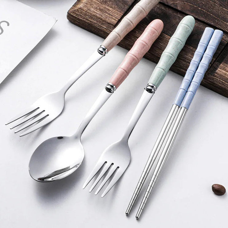 Set of kawaii utensils with colorful handles on a wooden board