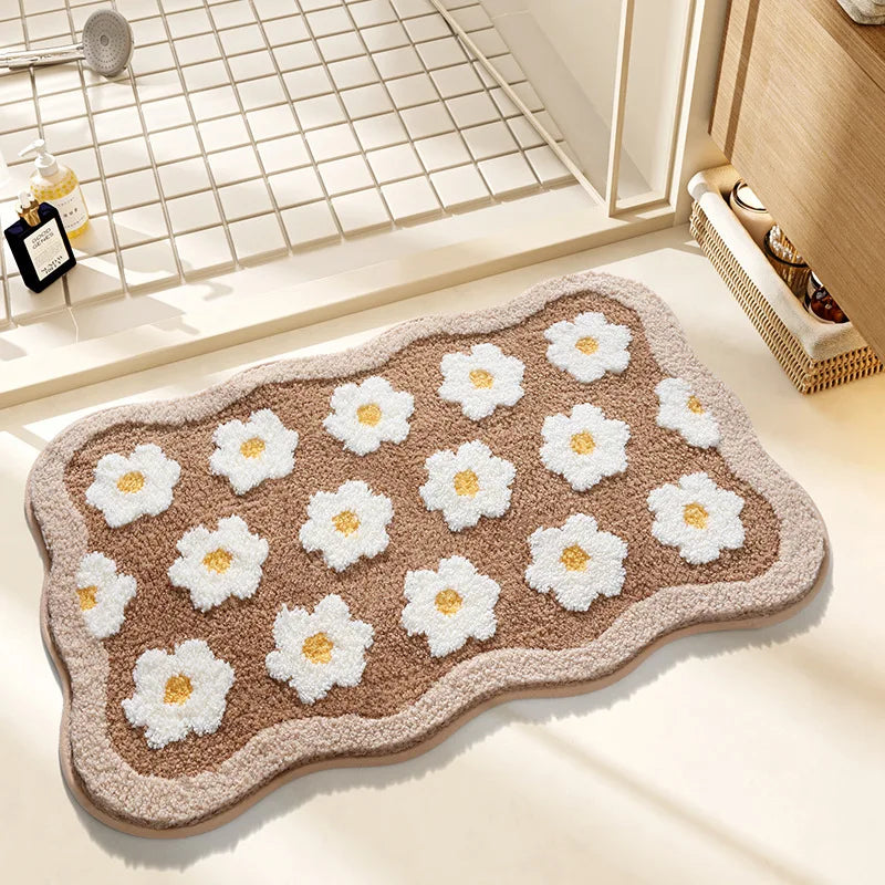 Kawaii bath mat with white flower patterns on a bathroom floor