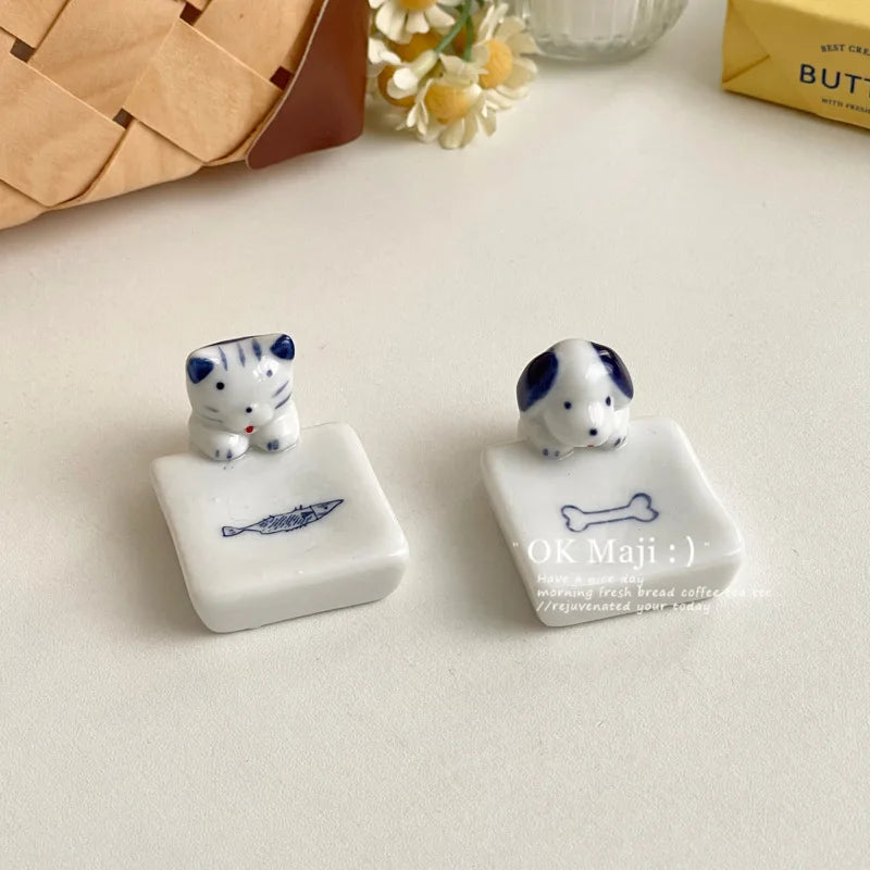 A set of kawaii chopstick holder designs with cat and dog patterns