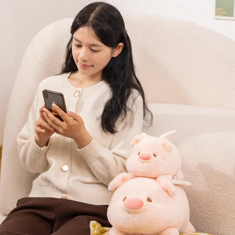 Woman sitting on a couch using a smartphone with a kawaii plush toy next to her