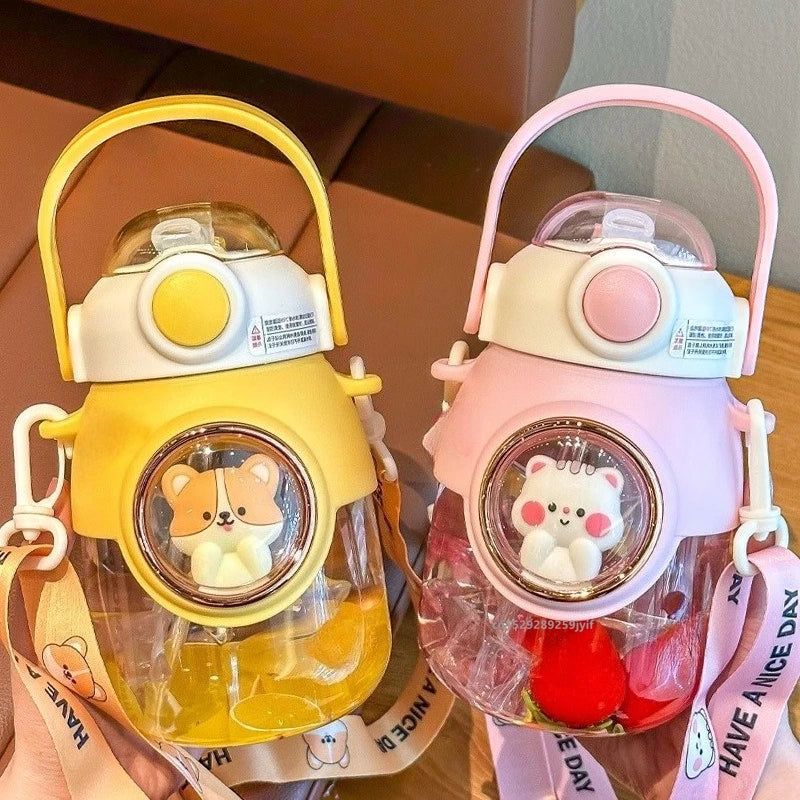 Two colorful kawaii water bottles with cartoon character designs on a wooden surface.