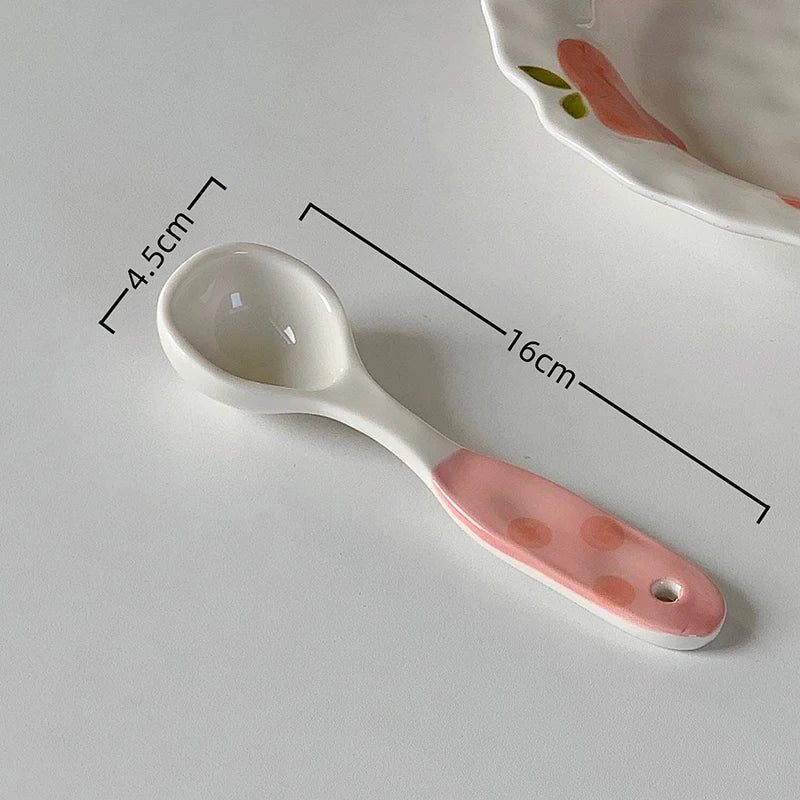 A white ceramic kawaii spoon on a table