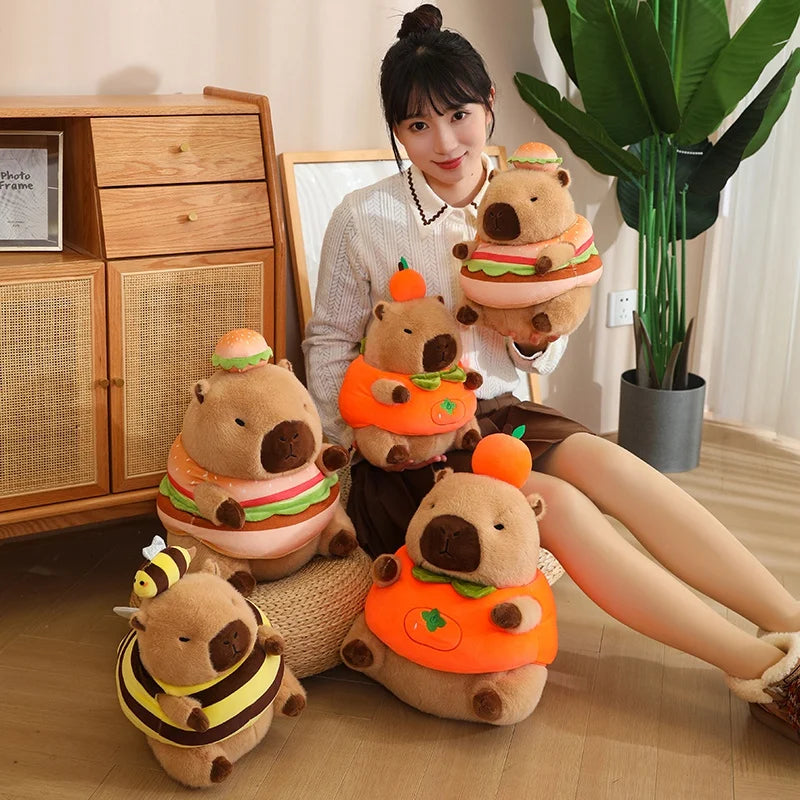 Woman sitting on the floor with kawaii plush toys shaped like bears in various outfits.