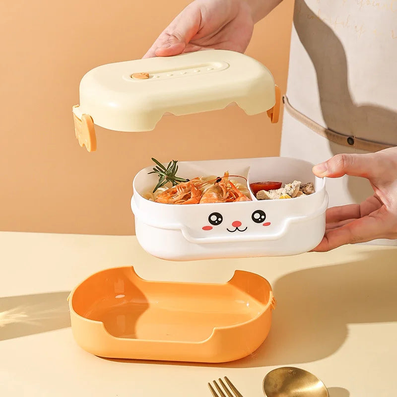 Children's kawaii lunch box with cartoon face design on a beige background