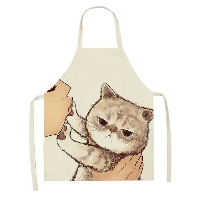 Kawaii apron with a cat design held by hands on a white background