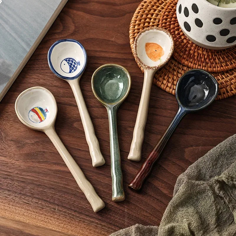 Five kawaii spoons on a wooden surface