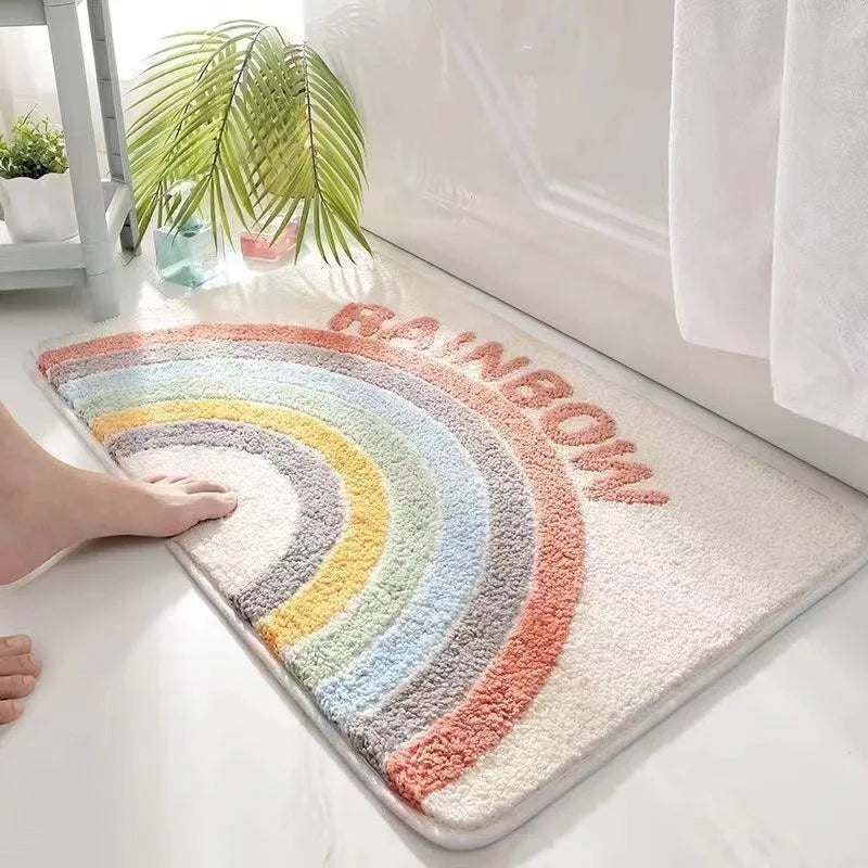 Rainbow-shaped Kawaii doormat with 'Rainbow' text on a white floor.