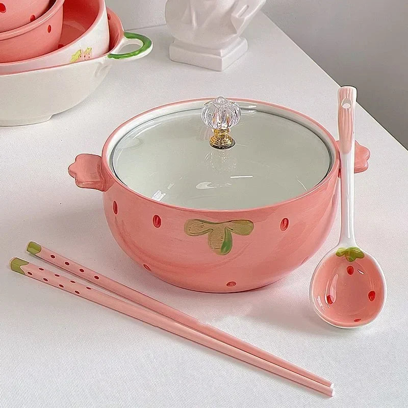 A strawberry design kawaii bowls with spoons and chopsticks