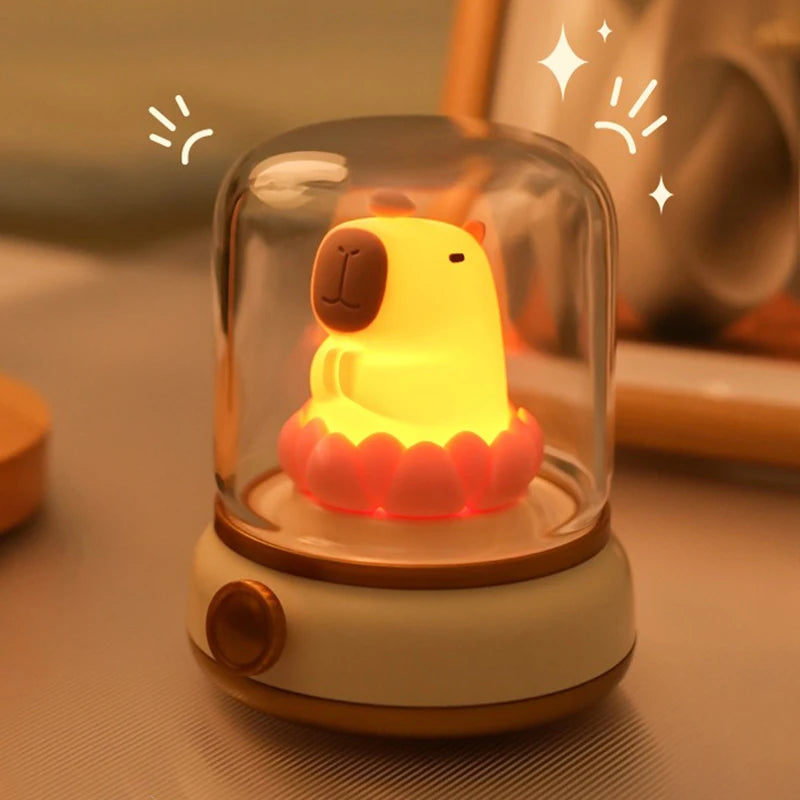 Cute kawaii animal-shaped night light with a clear dome on a soft background