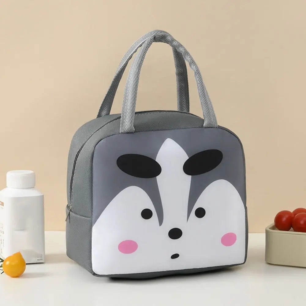 Kawaii lunch bag with cartoon face design on a beige background
