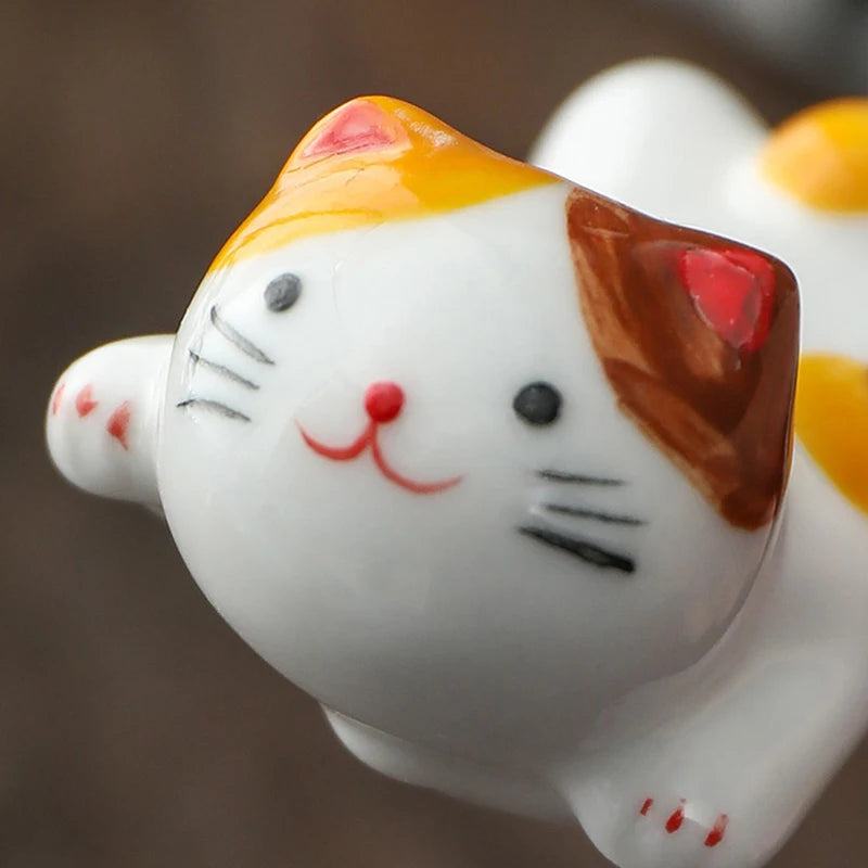 Close-up of a ceramic kawaii cat figurine with a blurred background