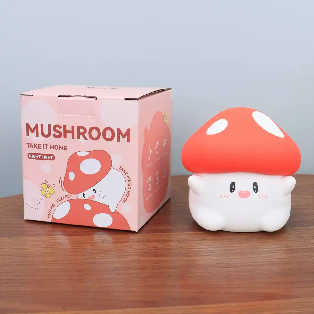 Mushroom-shaped kawaii night light with packaging on a wooden surface