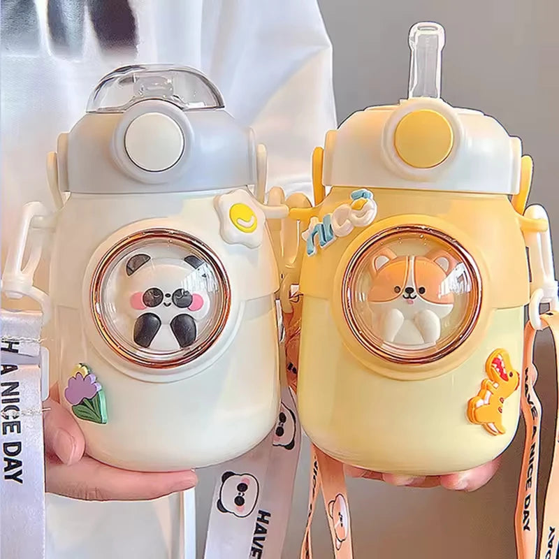 Two cute kawaii water bottles with animal-themed designs held by a person.