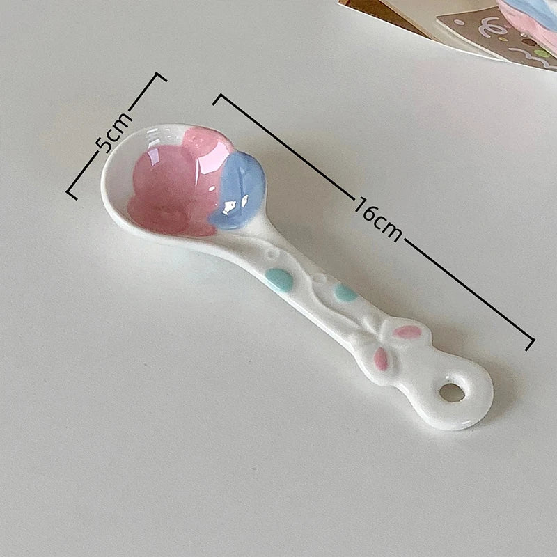 A white ceramic kawaii spoon on a table