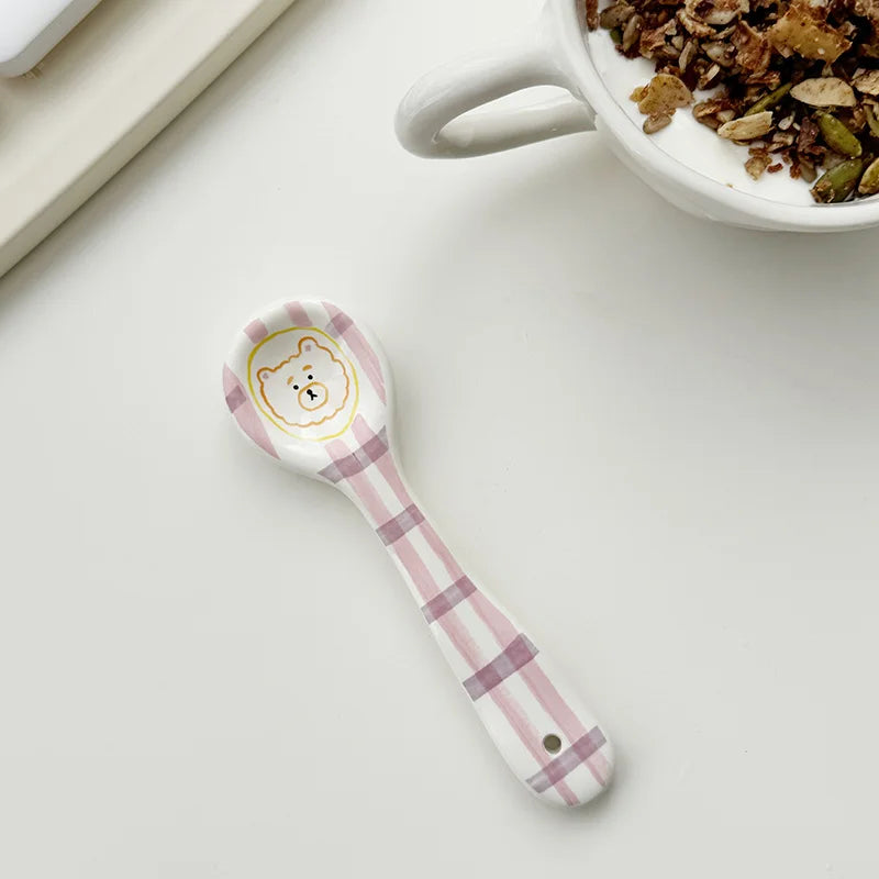 A teddy bear kawaii spoon on a kitchen table
