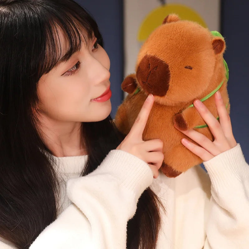 Woman holding a brown kawaii plush toy against a neutral background