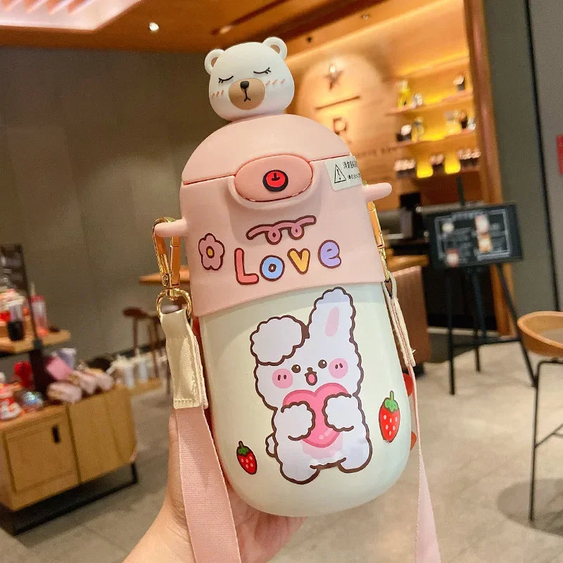 Cute cartoon kawaii water bottle with bear on top held in a store setting