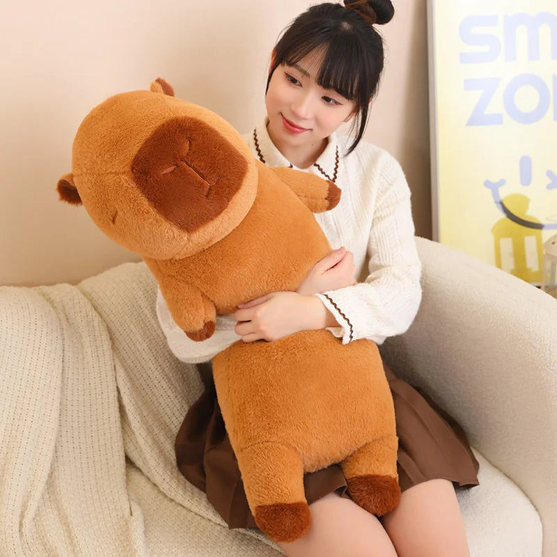 Woman holding a large brown kawaii plush toy on a couch
