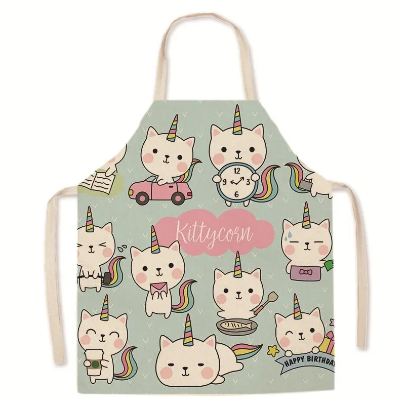 Children's kawaii apron with Kittycorn cat design on a light green background