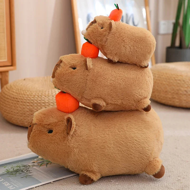Stack of three brown plush kawaii toys resembling rodents with orange carrots on a light-colored floor.
