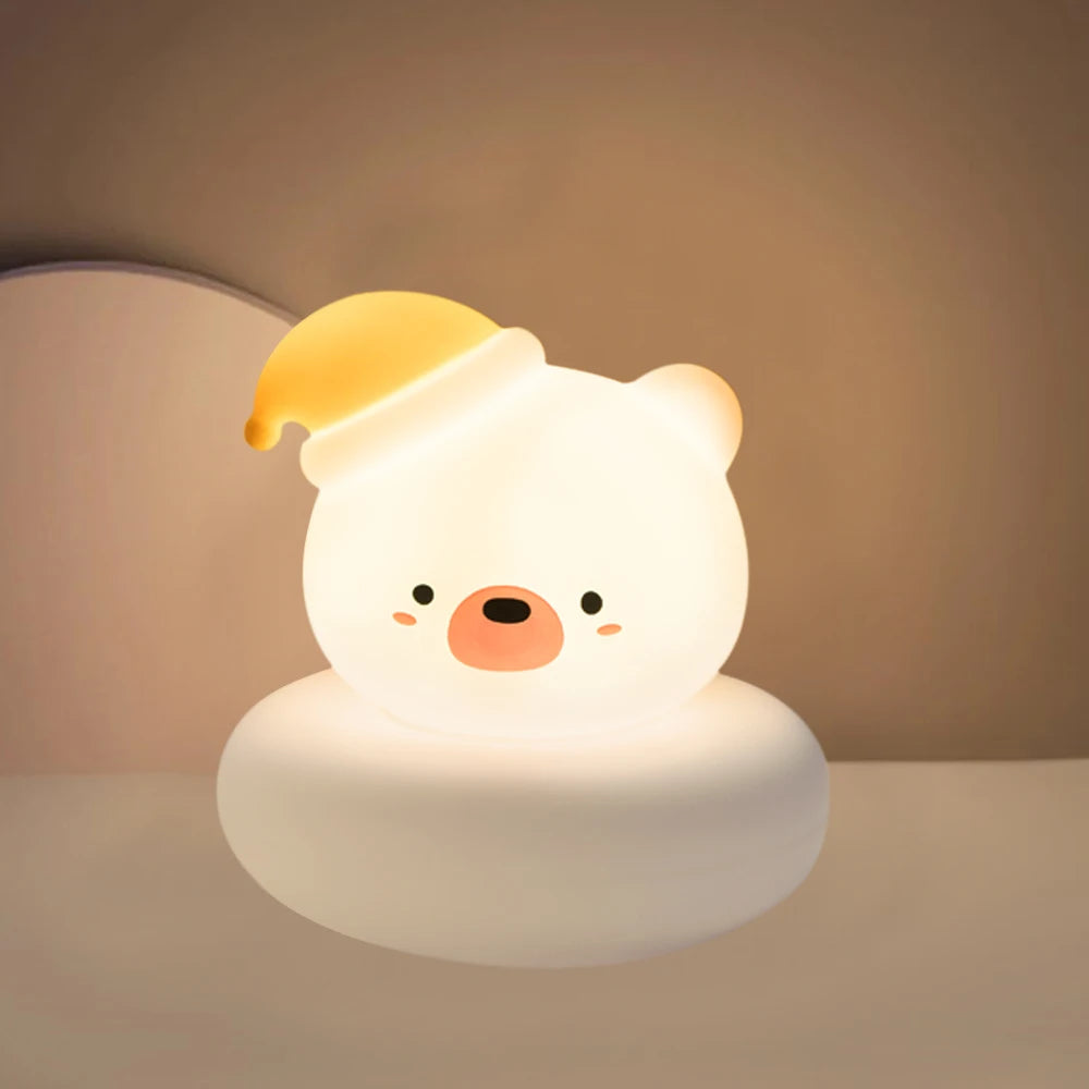 Cute kawaii animal-shaped night light with a yellow hat on a neutral background