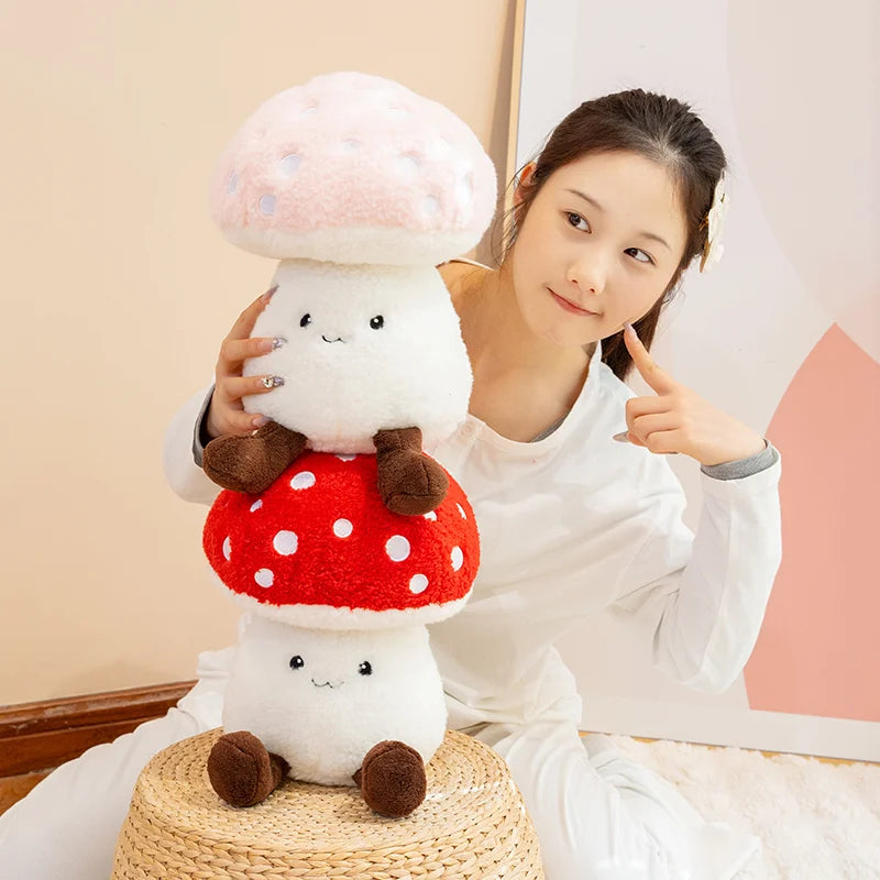 Person holding a kawaii plush mushroom toy with a smiley face