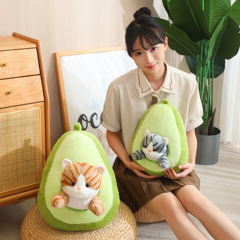 Woman holding a kawaii plush avocado toy with a cat design in a room setting.