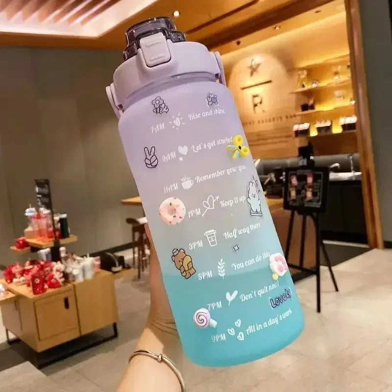 Colorful kawaii water bottle with cartoon designs held in a casual setting