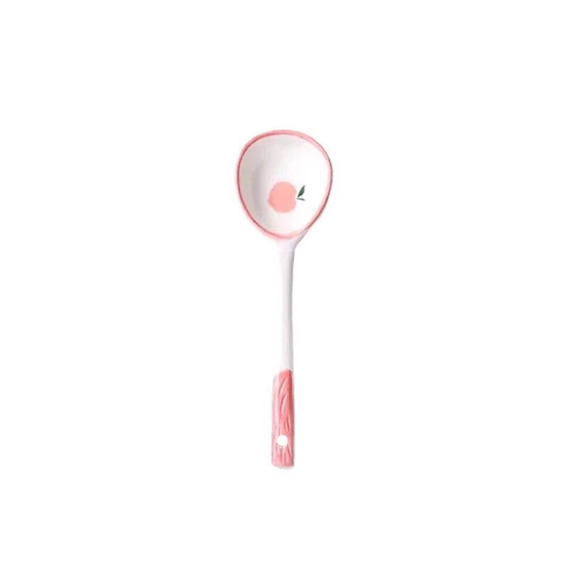 A pink and white kawaii spoon on a white background