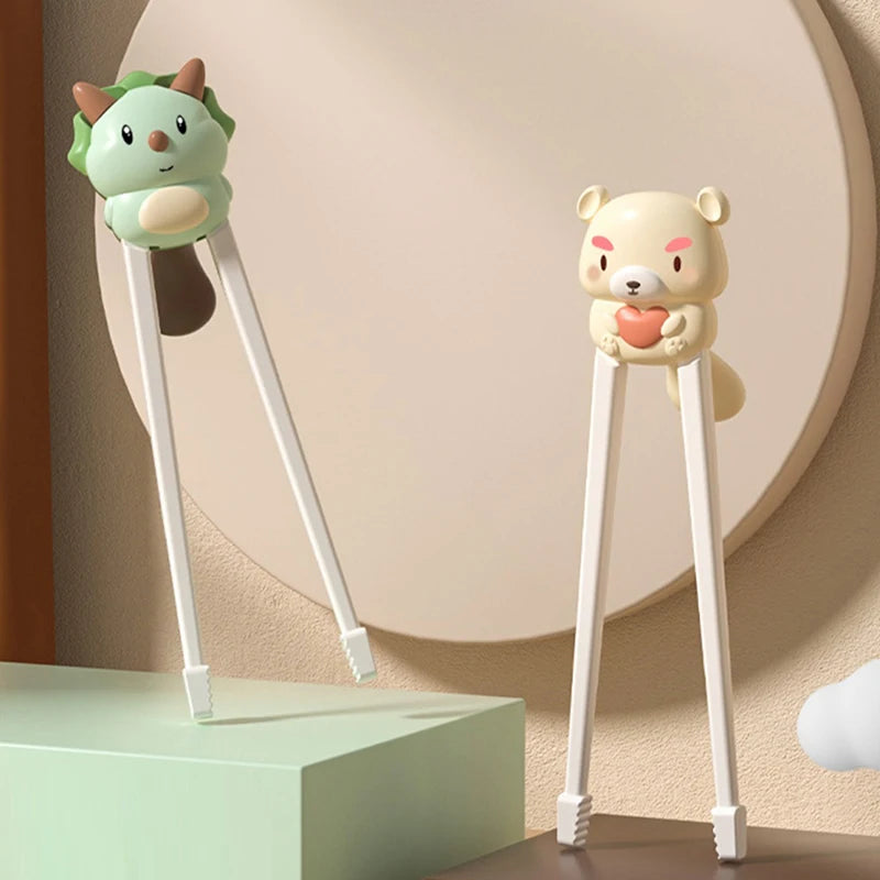 Two cartoon character kawaii chopsticks on a neutral background