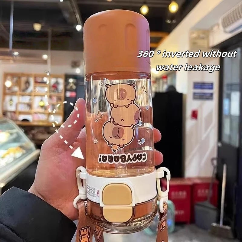Hand holding a kawaii water bottle with a store interior in the background