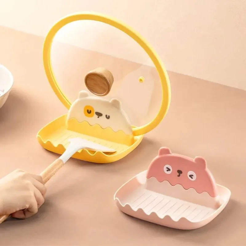 Children's kitchen tool set with kawaii cartoon character design on a beige background