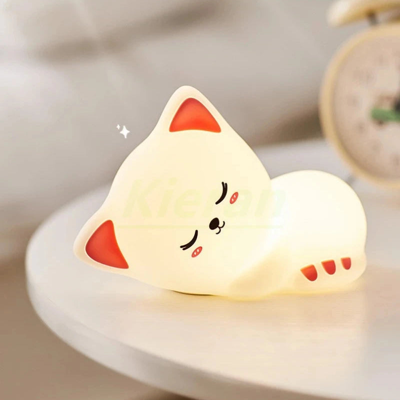 Cute kawaii cat-shaped night light on a blurred background