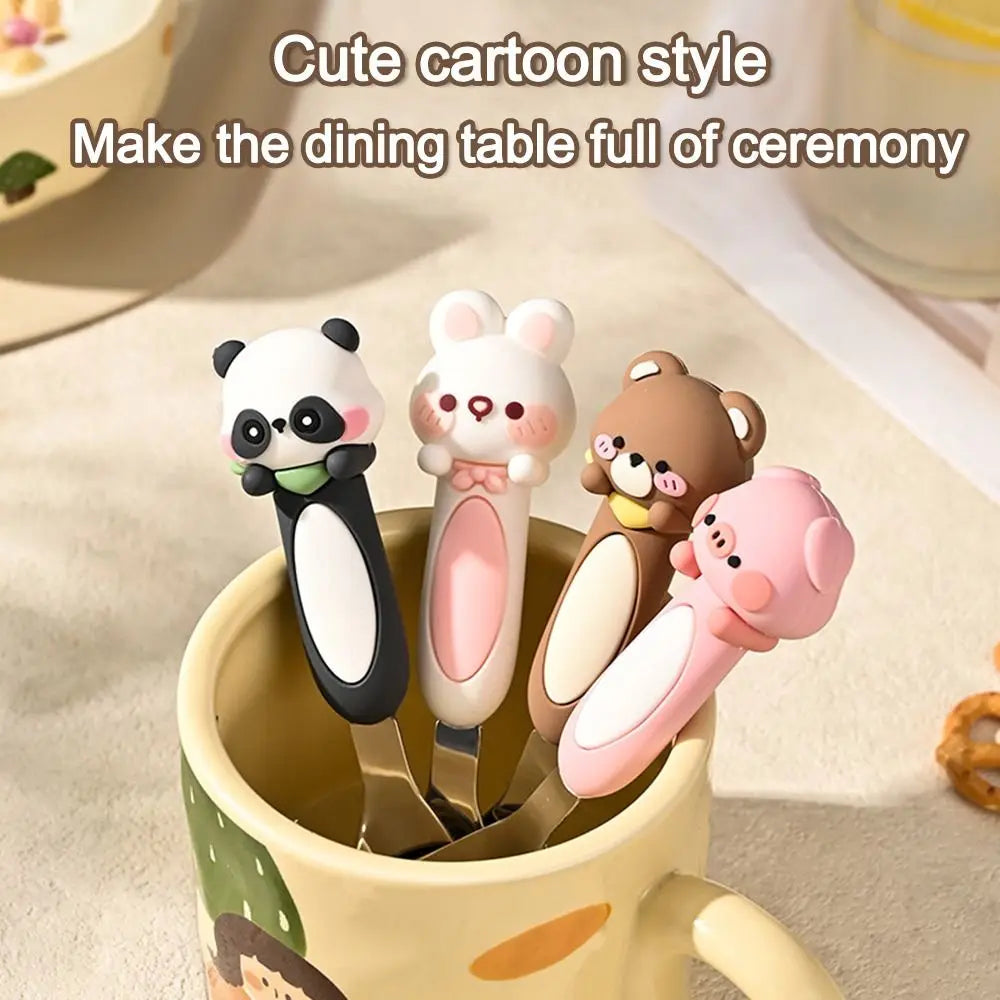 A group of four animal designed kawaii spoons inside a mug