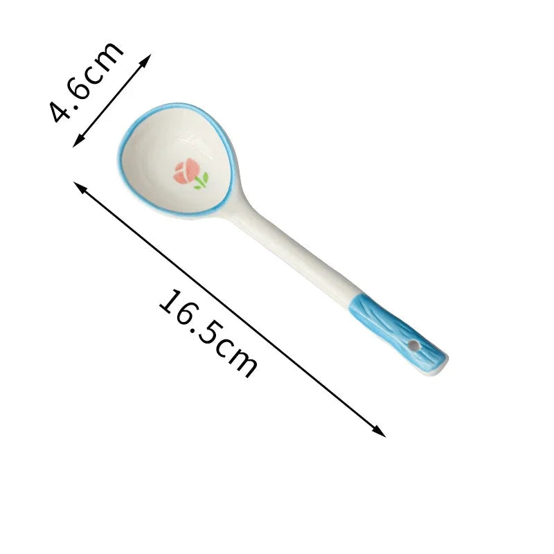 A blue and white kawaii spoon on a white background