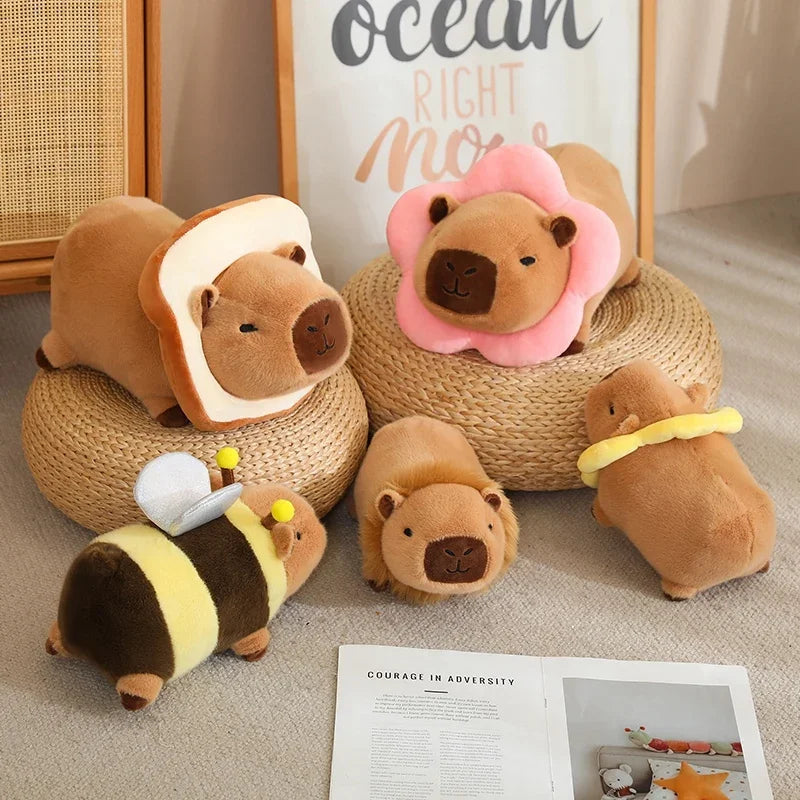 Set of brown kawaii plush toys resembling animals on a textured surface with a framed picture in the background.