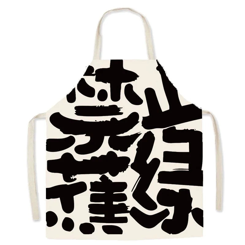 White kawaii apron with black abstract designs on a white background
