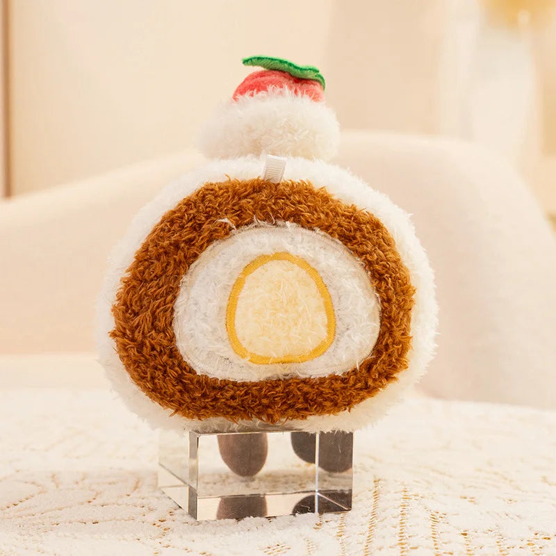Kawaii plush toy resembling a roll cake on a stand with a soft, blurred background